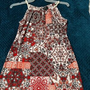 Medium multi-colored dress from Love, with a spiral strap. Perfect for summer!